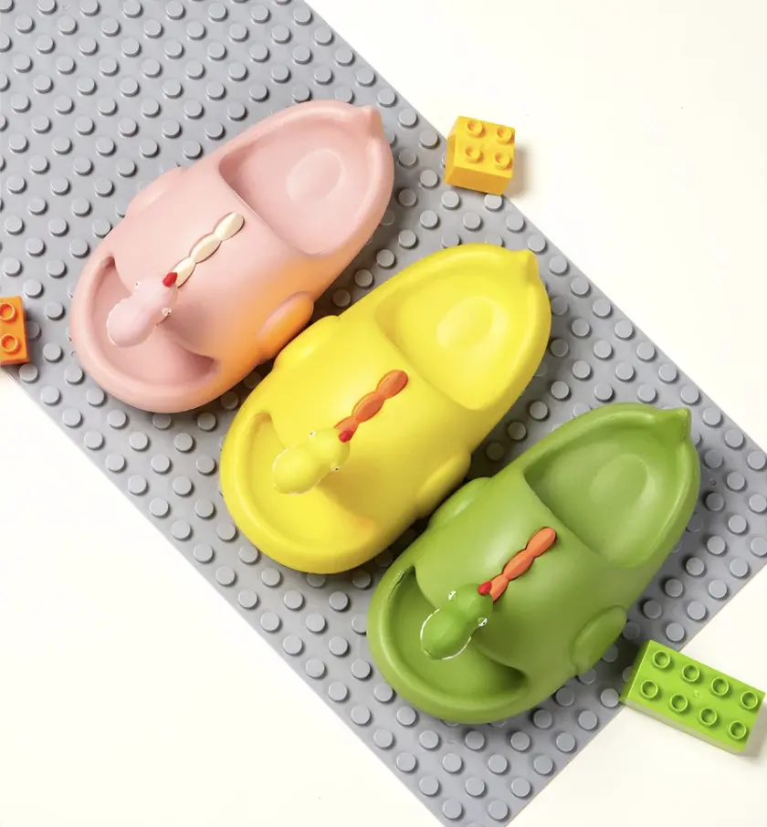 Claquette enfant en forme de dinosaure